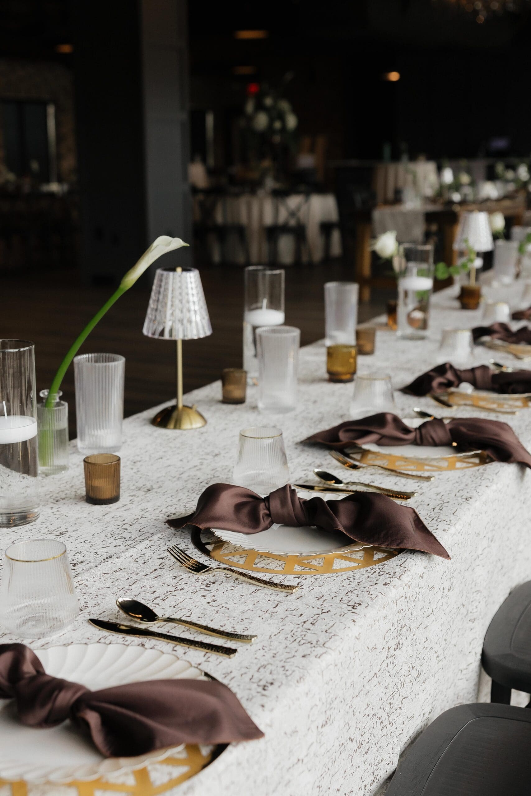 Brown and white table decorations. White lily table decorations